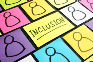 Inclusion sign and post-its with figures of people.