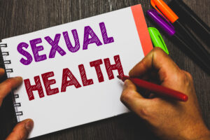 Hand writing showing Sexual Health.