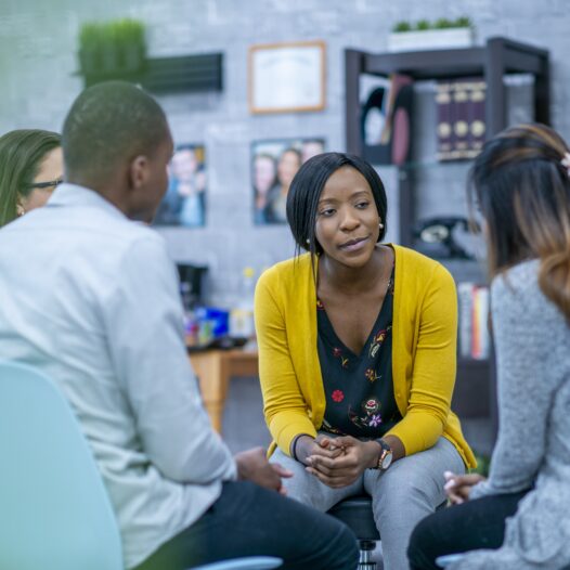 Social worker working with diverse group of clients