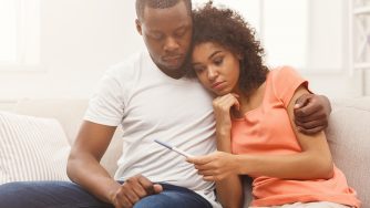 Sad black couple after pregnancy test result