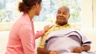 Daughter tending to her sick father