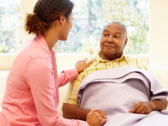 Daughter tending to her sick father