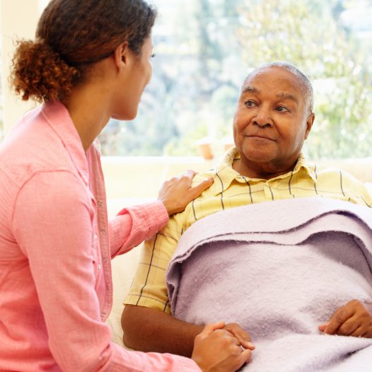 Daughter tending to her sick father