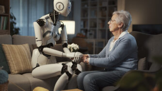 Elderly white woman sitting in her living room confiding to an AI driven robot.