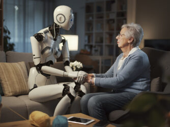 Elderly white woman sitting in her living room confiding to an AI driven robot.