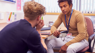 Instructor in conversation with an upset student.