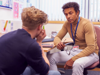 Instructor in conversation with an upset student.