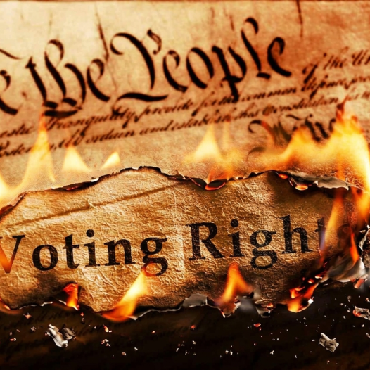 Picture of the Constitution with "Voting Rights" on fire.